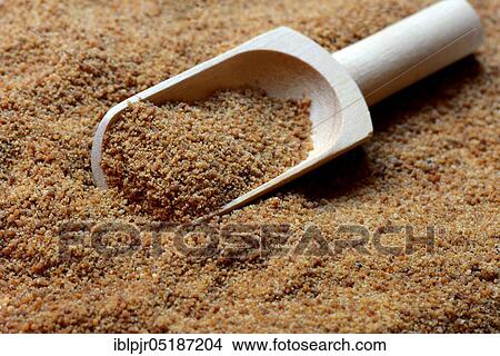 Picture - Coconut blossom sugar with shovel. Fotosearch