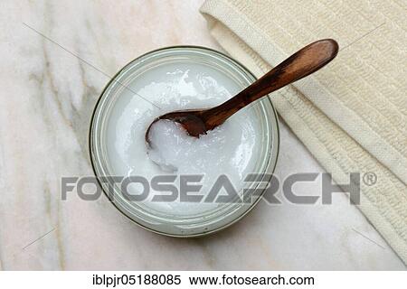 Coconut oil with wooden spoon View Large Photo Image Stock Photography - Coconut oil with wooden spoon. Fotosearch