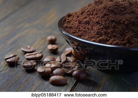 Stock Photo - Coffee beans and coffee powder in shell, Coffea arabica. Fotosearch