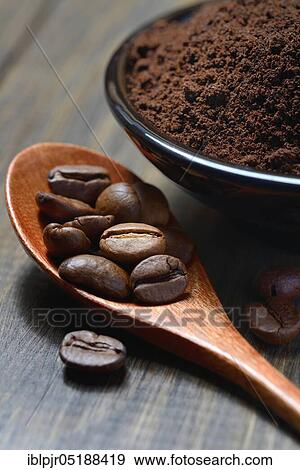 Stock Photo - Coffee beans and coffee powder in shell, Coffea arabica. Fotosearch