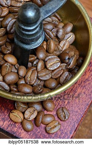 Stock Photo - Coffee beans in a coffee mill. Fotosearch
