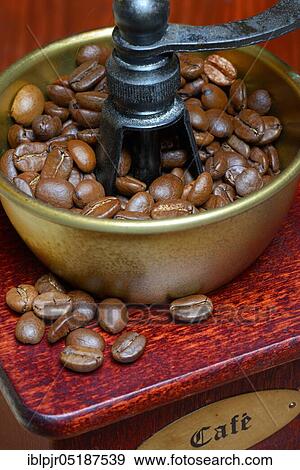 Coffee beans in a coffee mill View Large Photo Image Stock Photo - Coffee beans in a coffee mill. Fotosearch