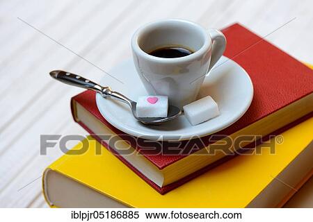 Coffee cup on books and coffee spoon with sugar cubes, espresso View Large Photo Image Stock Photography - Coffee cup on books and coffee spoon with sugar cubes, espresso. Fotosearch