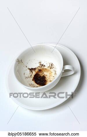 Stock Photography - Coffee grounds in cup, read coffee grounds. Fotosearch