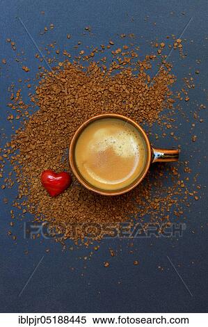 Stock Photography - Coffee in coffee cup and instant coffee, red heart, Coffea arabica. Fotosearch