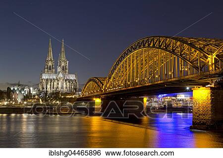 Cologne Cathedral and Philharmonic Hall with Hohenzollern Bridge, night scene, Köln, Cologne, North Rhine-Westphalia, Germany, Europe View Large Photo Image Stock Photograph - Cologne Cathedral and Philharmonic Hall with Hohenzollern Bridge, night scene, Köln, Cologne, North Rhine-Westphalia, Germany, Europe. Fotosearch