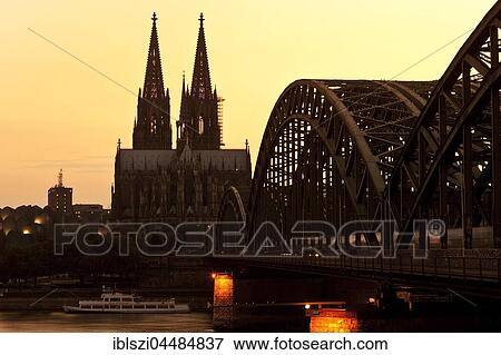 Cologne cathedral with Hohenzollern bridge at sunset, Cologne, Rhineland, North Rhine-Westphalia, Germany, Europe View Large Photo Image Stock Photo - Cologne cathedral with Hohenzollern bridge at sunset, Cologne, Rhineland, North Rhine-Westphalia, Germany, Europe. Fotosearch