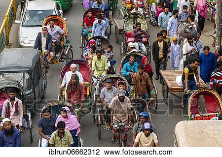 Completely with rickshaws overcrowded street in the center of Dhaka, Bangladesh, Asia View Large Photo Image Stock Image - Completely with rickshaws overcrowded street in the center of Dhaka, Bangladesh, Asia. Fotosearch