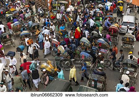 Stock Photo - Completely with rickshaws overcrowded street in the center of Dhaka, Bangladesh, Asia. Fotosearch