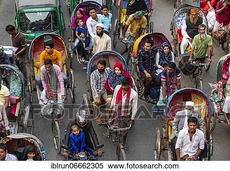 Completely with rickshaws overcrowded street in the center of Dhaka, Bangladesh, Asia View Large Photo Image Stock Photography - Completely with rickshaws overcrowded street in the center of Dhaka, Bangladesh, Asia. Fotosearch