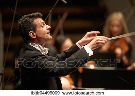 Conductor Ruben Gimeno conducts Staatsorchester Rheinische Philharmonie, Music Department, Koblenz, Rhineland-Palatinate, Germany, Europe View Large Photo Image Stock Photo - Conductor Ruben Gimeno conducts Staatsorchester Rheinische Philharmonie, Music Department, Koblenz, Rhineland-Palatinate, Germany, Europe. Fotosearch