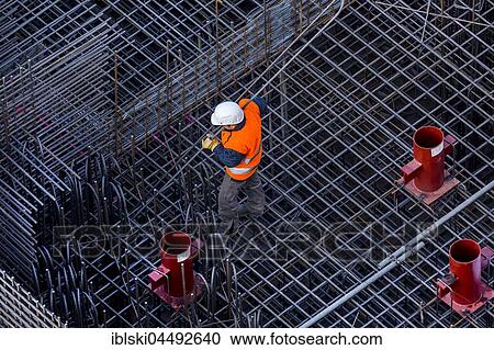 Stock Image - Construction workers processing reinforcing steel for reinforced concrete ceiling, Bavaria, Germany, Europe. Fotosearch
