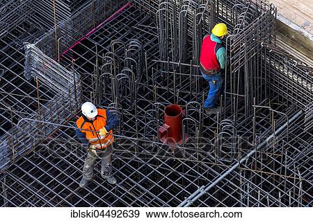 Stock Photo - Construction workers processing reinforcing steel for reinforced concrete ceiling, Bavaria, Germany, Europe. Fotosearch
