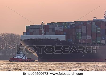 Container ship with tractor on the Elbe, Hamburg, Germany, Europe View Large Photo Image Stock Image - Container ship with tractor on the Elbe, Hamburg, Germany, Europe. Fotosearch