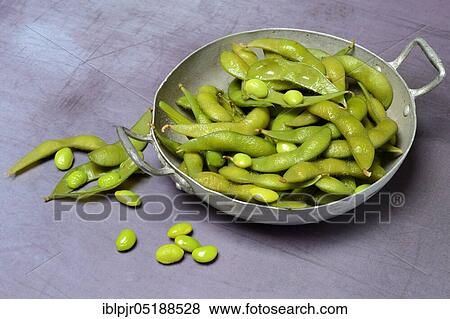 Stock Photo - Cooked unripe soya beans in shell, edamame, glycine max. Fotosearch