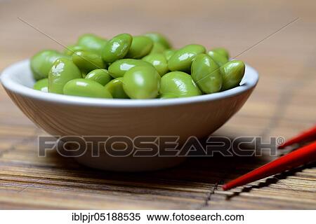 Stock Photography - Cooked unripe soya beans in shell, edamame, glycine max. Fotosearch