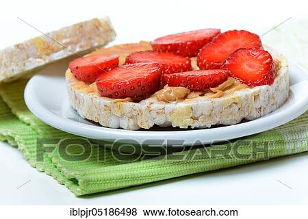 Corn and rice wafer topped with strawberries and peanut butter View Large Photo Image Stock Photo - Corn and rice wafer topped with strawberries and peanut butter. Fotosearch
