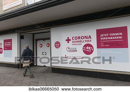 Stock Image - Corona quick test poster on a shop window, Düsseldorf, North Rhine-Westphalia, Germany, Europe. Fotosearch