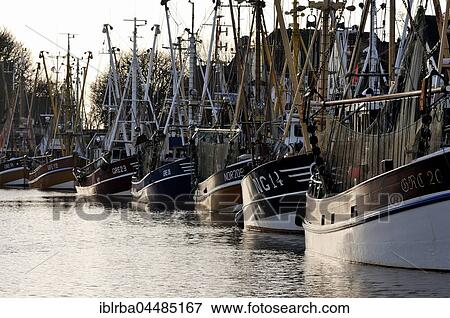 Crab cutters in the harbor of Greetsiel, North Sea, Lower Saxony, Germany, Europe View Large Photo Image Stock Photo - Crab cutters in the harbor of Greetsiel, North Sea, Lower Saxony, Germany, Europe. Fotosearch