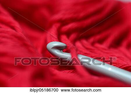 Stock Image - Crochet hooks with manual work. Fotosearch