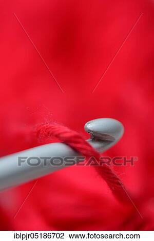 Stock Image - Crochet hooks with manual work. Fotosearch