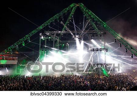 Crowd at Laser Show, Festival Techno Rave Nature One 2016, Red Dancing Flames, Hunsrück, Kastellaun, Rhineland-Palatinate, Germany, Europe View Large Photo Image Stock Image - Crowd at Laser Show, Festival Techno Rave Nature One 2016, Red Dancing Flames, Hunsrück, Kastellaun, Rhineland-Palatinate, Germany, Europe. Fotosearch
