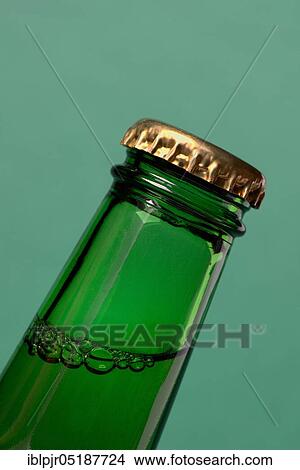Picture - Crown cap on beer bottle. Fotosearch