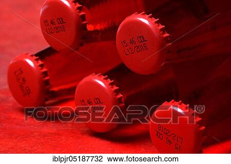 Crown cap with coding on bottles, coding, Campari View Large Photo Image Stock Image - Crown cap with coding on bottles, coding, Campari. Fotosearch
