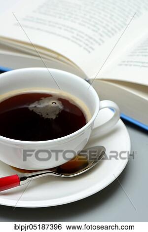 Stock Photograph - Cup of coffee and book. Fotosearch