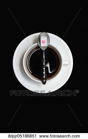 Cup with coffee, spoon and sugar cube with heart View Large Photo Image Stock Image - Cup with coffee, spoon and sugar cube with heart. Fotosearch