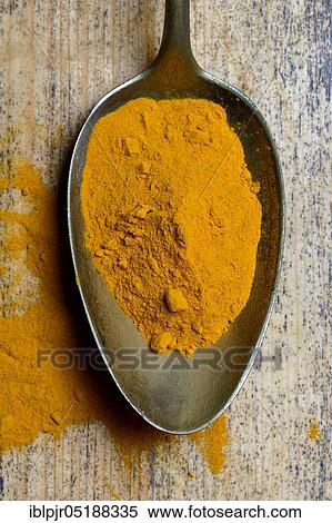 Stock Photography - Curcuma powder in spoon, turmeric longa. Fotosearch