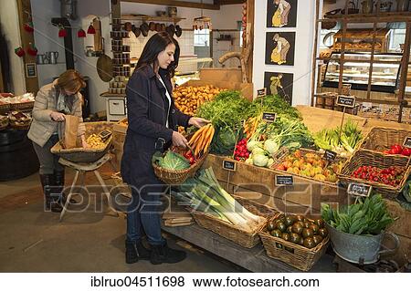 Stock Photo - Customer buying carrots at farm shop, asparagus farm Schulte-Scherlebeck, Herten, Ruhr district, North Rhine-Westphalia, Germany, Europe. Fotosearch