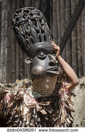 Dancer in traditional clothing wearing carved mask, Atchum, Fon's Palace, Bafut, Bamenda, North-West Region, Cameroon, Africa View Large Photo Image Stock Image - Dancer in traditional clothing wearing carved mask, Atchum, Fon's Palace, Bafut, Bamenda, North-West Region, Cameroon, Africa. Fotosearch