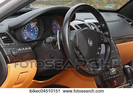 Stock Image - Dashboard with steering wheel, Maserati Quattroporte, sedan. Fotosearch