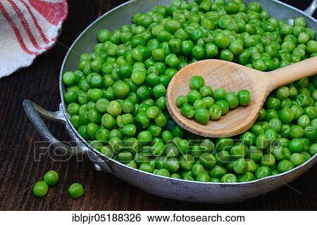 Defrosted green peas in shell with cooking spoon, Pisum sativum View Large Photo Image Stock Photograph - Defrosted green peas in shell with cooking spoon, Pisum sativum. Fotosearch