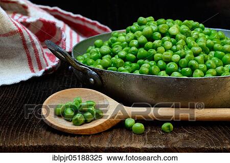 Defrosted green peas in shell with cooking spoon, Pisum sativum View Large Photo Image Stock Photography - Defrosted green peas in shell with cooking spoon, Pisum sativum. Fotosearch