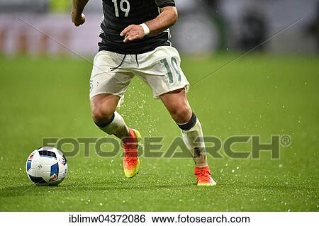 Detail, legs of Mario Goetze, German football player, playing the ball when it is raining, WWK Arena, Augsburg, Bavaria, Germany, Europe View Large Photo Image Stock Photograph - Detail, legs of Mario Goetze, German football player, playing the ball when it is raining, WWK Arena, Augsburg, Bavaria, Germany, Europe. Fotosearch
