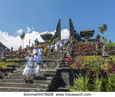 Stock Photo - Devout Balinese descend stairs, split gate, Candi bentar, mother temple Besakih, Pura Agung Besakih Penetaran, Banjar Besakih, Bali, Indonesia, Asia. Fotosearch