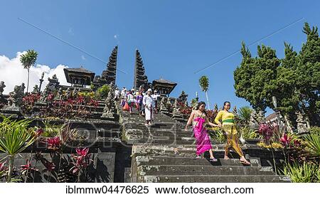 Stock Photography - Devout Balinese descend stairs, split gate, Candi bentar, mother temple Besakih, Pura Agung Besakih Penetaran, Banjar Besakih, Bali, Indonesia, Asia. Fotosearch