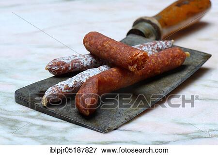 Different kinds of sausages on a chopper View Large Photo Image Stock Photo - Different kinds of sausages on a chopper. Fotosearch