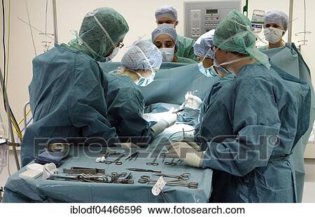 Doctors during surgery, operating room in the hospital, Hamburg, Germany, Europe View Large Photo Image Stock Photograph - Doctors during surgery, operating room in the hospital, Hamburg, Germany, Europe. Fotosearch