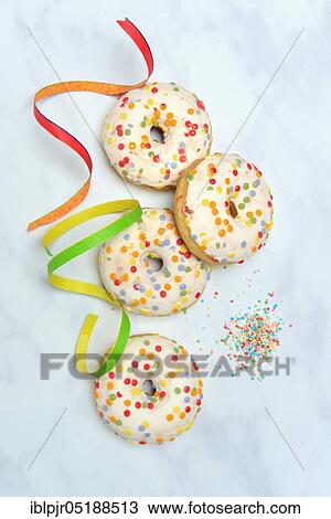 Donuts and streamers, sugar icing, sugar glaze View Large Photo Image Stock Image - Donuts and streamers, sugar icing, sugar glaze. Fotosearch