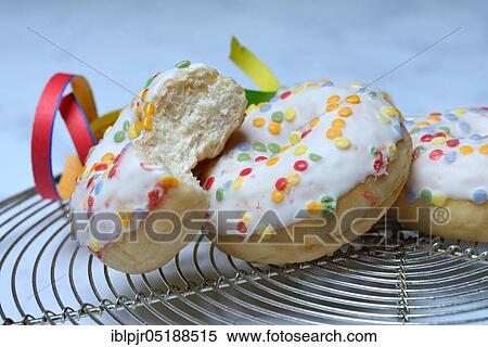 Donuts and streamers, sugar icing, sugar glaze View Large Photo Image Stock Photography - Donuts and streamers, sugar icing, sugar glaze. Fotosearch