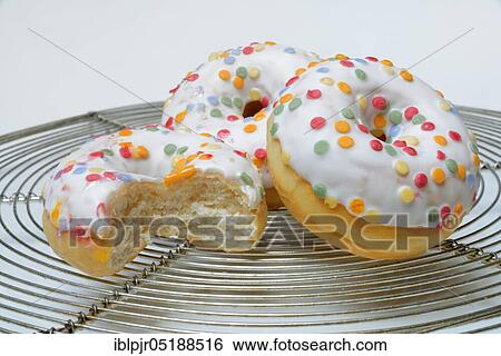 Donuts, sugar icing, sugar glaze View Large Photo Image Stock Photograph - Donuts, sugar icing, sugar glaze. Fotosearch