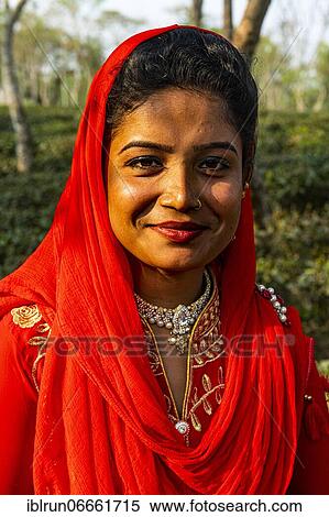 Dressed up girl posing before Tea plants on a Tea plantation in Sreemagal, Bangladesh, Asia View Large Photo Image Stock Photography - Dressed up girl posing before Tea plants on a Tea plantation in Sreemagal, Bangladesh, Asia. Fotosearch