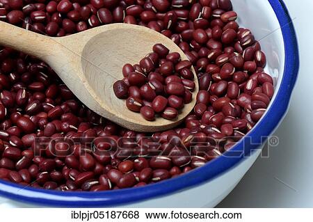 Stock Photo - Dried azuki beans in bowl with wooden spoon, Vigna angularis. Fotosearch