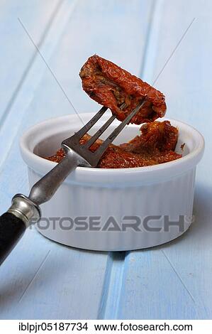 Dried tomato in olive oil, antipasti, Solanum lycopersicum View Large Photo Image Picture - Dried tomato in olive oil, antipasti, Solanum lycopersicum. Fotosearch