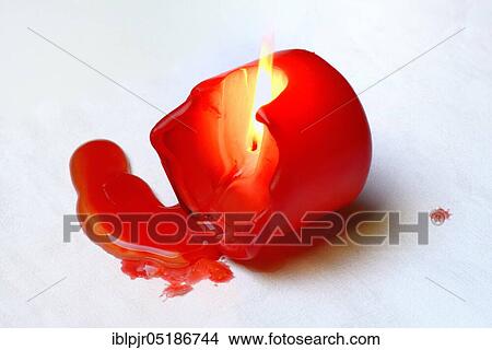 Dropped, burning candle on fabric View Large Photo Image Picture - Dropped, burning candle on fabric. Fotosearch