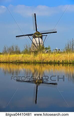 Dutch windmill on a canal, Kinderdijk, Alblasserwaard polder, South Holland, The Netherlands, Europe View Large Photo Image Stock Image - Dutch windmill on a canal, Kinderdijk, Alblasserwaard polder, South Holland, The Netherlands, Europe. Fotosearch
