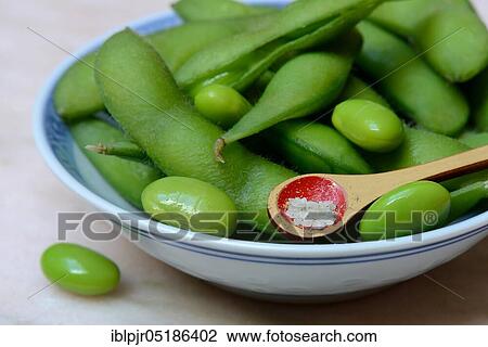 Edamame, cooked unripe Soya beans (Glycine max) in bowl, spoon with spiced salt Shichimi Togarashi View Large Photo Image Stock Image - Edamame, cooked unripe Soya beans (Glycine max) in bowl, spoon with spiced salt Shichimi Togarashi. Fotosearch